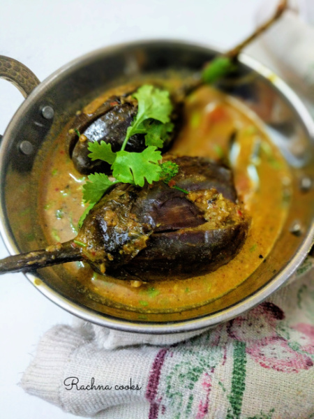 Two small aubergines served with curry in a small wok