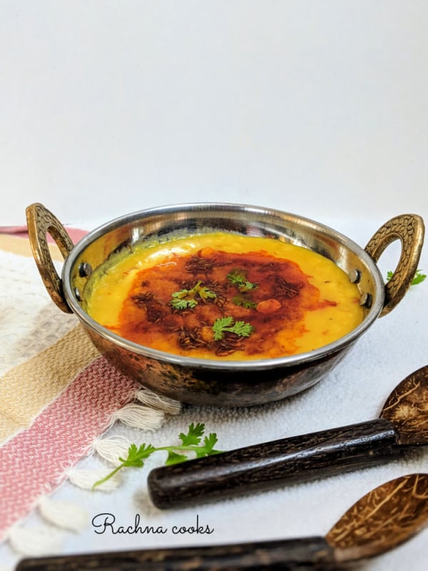 Punjabi dal tadka or lentils with a nice tadka in a wok.