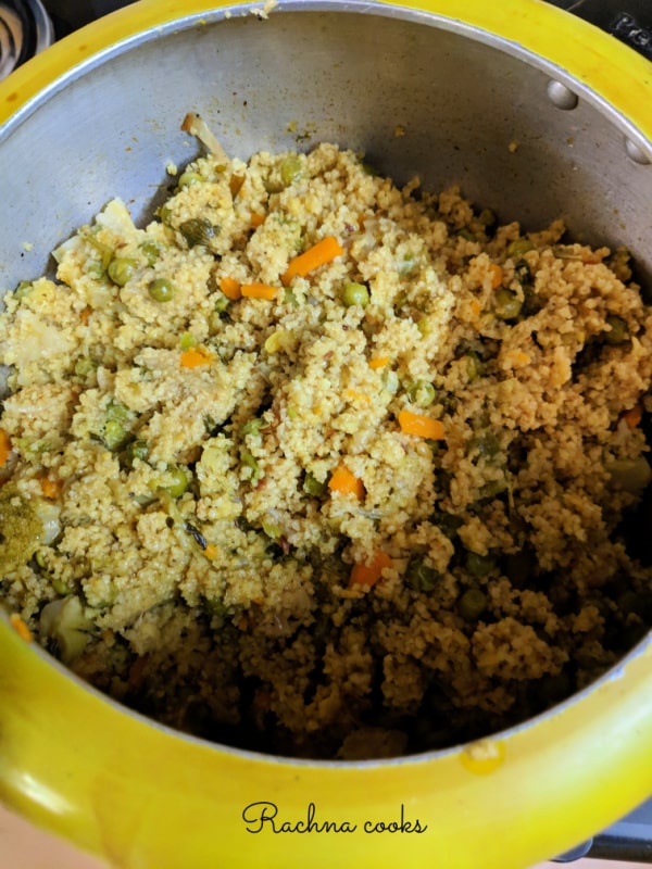 foxtail millet khichdi is fluffly and cooked. It has veggies like carrots and peas.