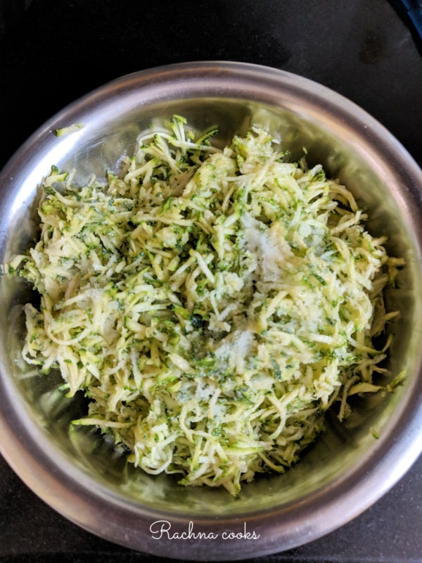grated zucchini with salt in a bowl
