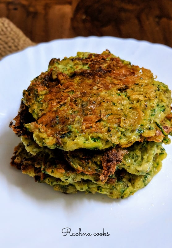 zucchini fritters stacked on each other on a plate