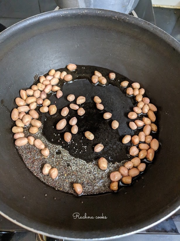 Brown mustard seeds and peanuts in oil