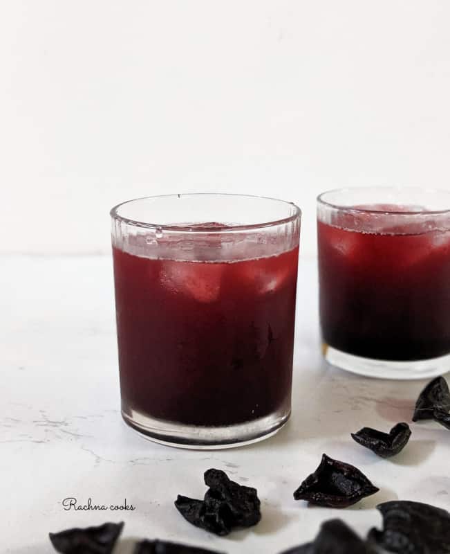 Two glasses of kokum sharbat with ice cubes