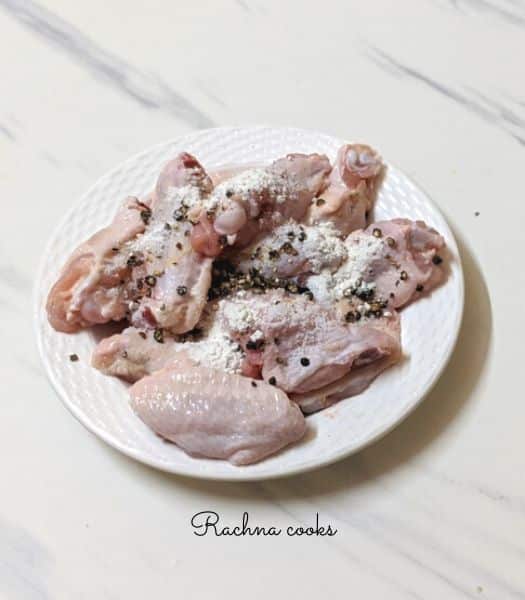 chicken wings with salt, pepper, garlic powder and baking powder